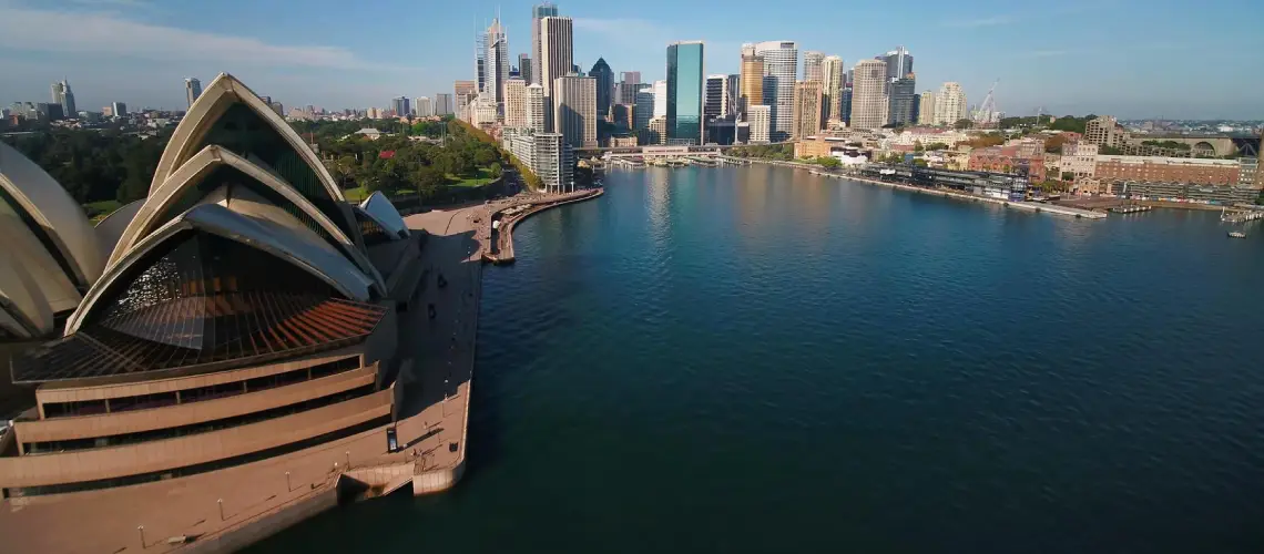 Sydney skyline with property valuer assessing real estate for fair market value